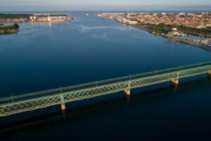 Aerial drone view of the old iron bridge over the river Lima in Viana do Castelo, Portugal